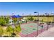 Community basketball court with shade structure, landscaping, and nearby residences at 10160 Tree Blossom Ave, Las Vegas, NV 89166