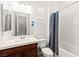 Clean bathroom with a single sink vanity, modern fixtures, and subway tile shower at 10160 Tree Blossom Ave, Las Vegas, NV 89166