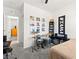 A bedroom featuring a drum set, closet, and view to the hallway at 10160 Tree Blossom Ave, Las Vegas, NV 89166