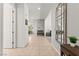 Bright hallway that leads to the living areas, showcasing tile flooring and neutral walls at 10160 Tree Blossom Ave, Las Vegas, NV 89166