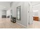 Hallway featuring tiled flooring, decorative mirrors and access to bathroom at 10160 Tree Blossom Ave, Las Vegas, NV 89166