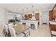 Open concept kitchen and dining area with stainless steel appliances and a large island at 10160 Tree Blossom Ave, Las Vegas, NV 89166