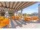 Outdoor patio featuring wood pergola, brick flooring and seating at 10160 Tree Blossom Ave, Las Vegas, NV 89166