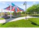 Community playground featuring colorful shade covers, play structures, and a well-maintained lawn at 10160 Tree Blossom Ave, Las Vegas, NV 89166