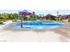 Community splash pad area with various water features and ample space for to play and cool off at 10160 Tree Blossom Ave, Las Vegas, NV 89166