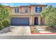 Charming two-story home with stucco exterior, tiled roof, and well-maintained landscaping at 10343 Beallsville St, Las Vegas, NV 89141