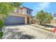 Charming two-story home with stucco exterior, tiled roof, and well-maintained landscaping at 10343 Beallsville St, Las Vegas, NV 89141