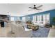Spacious living room filled with natural light with an open floor plan to the dining area and kitchen at 10343 Beallsville St, Las Vegas, NV 89141