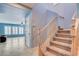 Inviting staircase with carpeted steps leading to the upper level of the home at 10343 Beallsville St, Las Vegas, NV 89141