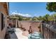 Private backyard featuring a covered patio and landscaped area, perfect for outdoor entertaining at 10352 Natural Springs Ave, Las Vegas, NV 89129