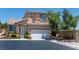 Charming two-story home featuring a well-maintained yard and a two-car garage at 10352 Natural Springs Ave, Las Vegas, NV 89129