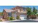 Beautiful two-story house with a well-manicured lawn and a welcoming front entrance at 10352 Natural Springs Ave, Las Vegas, NV 89129