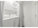 Bright laundry room features a washer, dryer, storage cabinets, and convenient access door at 10352 Natural Springs Ave, Las Vegas, NV 89129
