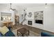 Open-concept living space with fireplace, lots of light, and staircase at 10352 Natural Springs Ave, Las Vegas, NV 89129