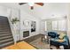 Bright living room features a cozy fireplace, built-in shelves, and comfortable seating at 10352 Natural Springs Ave, Las Vegas, NV 89129