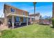 Large yard with desert landscaping, an outdoor dining area, and a trampoline at 1228 Swanbrooke Dr, Las Vegas, NV 89144