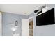 Bedroom featuring mounted TV, shelves, and sunny window at 1228 Swanbrooke Dr, Las Vegas, NV 89144