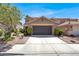 Charming two-story home with a well-maintained front yard and a spacious two-car garage at 1228 Swanbrooke Dr, Las Vegas, NV 89144