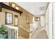 Upstairs hallway with decorative shelf, pictures, and white railing at 1228 Swanbrooke Dr, Las Vegas, NV 89144