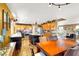 Open kitchen and dining area with wood floors, island, countertops and plentiful cabinet space at 1228 Swanbrooke Dr, Las Vegas, NV 89144