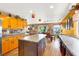 Kitchen area with island, cabinets, and dining area with backyard access at 1228 Swanbrooke Dr, Las Vegas, NV 89144