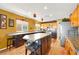 Spacious kitchen featuring an island, stainless steel refrigerator, and wood floors at 1228 Swanbrooke Dr, Las Vegas, NV 89144