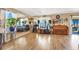 Open living space with hardwood floors, a piano, musical instruments, and large windows at 1228 Swanbrooke Dr, Las Vegas, NV 89144