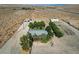 Aerial view showcasing the house, multiple buildings, and horse runs on the property at 12992 State Hwy 160, Las Vegas, NV 89161