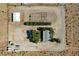 This aerial shot showcases a property with a well-maintained house, outbuildings, and spacious land at 12992 State Hwy 160, Las Vegas, NV 89161