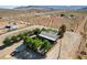 Property featuring mature trees, a fenced backyard, and various outbuildings at 12992 State Hwy 160, Las Vegas, NV 89161