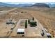 Sprawling desert estate with multiple buildings, horse facilities, and ample space for recreation at 12992 State Hwy 160, Las Vegas, NV 89161