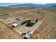 Aerial view of desert property including mature trees, outbuildings, and desert landscaping at 12992 State Hwy 160, Las Vegas, NV 89161