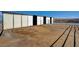 Outside of the barn featuring open horse runs adjacent to each stall for easy access at 12992 State Hwy 160, Las Vegas, NV 89161