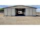 Horse barn with large sliding doors and ample space for equipment and livestock at 12992 State Hwy 160, Las Vegas, NV 89161