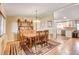 Dining room showcases a wooden table set, hardwood floors, and hutch at 12992 State Hwy 160, Las Vegas, NV 89161