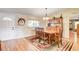 Dining room features hardwood floors, a rustic hutch, and natural light at 12992 State Hwy 160, Las Vegas, NV 89161