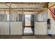 Spacious horse stalls within the barn featuring safety gates and convenient access at 12992 State Hwy 160, Las Vegas, NV 89161