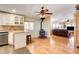 Open kitchen featuring white cabinets, stainless appliances, and wood burning stove at 12992 State Hwy 160, Las Vegas, NV 89161