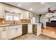 Beautiful kitchen with stainless steel appliances, granite countertops, a wine fridge, and hardwood flooring at 12992 State Hwy 160, Las Vegas, NV 89161