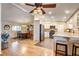 Bright kitchen featuring white cabinets, stainless appliances, and open dining area at 12992 State Hwy 160, Las Vegas, NV 89161