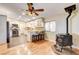 Open floorplan featuring a kitchen with white cabinets and stainless steel appliances at 12992 State Hwy 160, Las Vegas, NV 89161