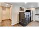 Well-equipped laundry room with modern washer/dryer and ample cabinet space at 12992 State Hwy 160, Las Vegas, NV 89161