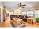 Open-concept living area with hardwood floors and large windows, creating a bright and inviting space at 12992 State Hwy 160, Las Vegas, NV 89161