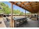 The outdoor bar has shaded seating and a view of the lush backyard at 12992 State Hwy 160, Las Vegas, NV 89161