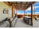 Inviting outdoor kitchen with a bar, grill, and desert views at 12992 State Hwy 160, Las Vegas, NV 89161