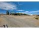 Exterior view of the property, including a large lot and outbuildings at 12992 State Hwy 160, Las Vegas, NV 89161