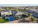 An elevated view of the backyard, pool, and outdoor living area with a glimpse of the neighborhood at 1304 Fantastic Ct, North Las Vegas, NV 89081