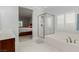 Bright bathroom featuring a glass-enclosed shower and a soaking tub at 1304 Fantastic Ct, North Las Vegas, NV 89081