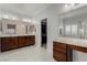 Spacious bathroom with double sink vanity, makeup counter, large mirrors and walk-in closet at 1304 Fantastic Ct, North Las Vegas, NV 89081