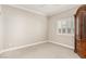 Bright bedroom with a neutral color palette, plantation shutters and a large wardrobe at 1304 Fantastic Ct, North Las Vegas, NV 89081